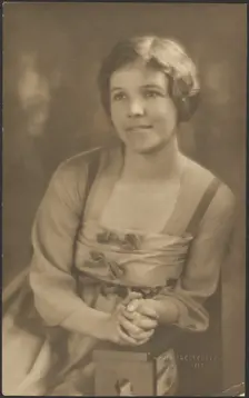 Portrait of a Woman with Ribbon Bows on Dress, 1907-1924. Creator: Louis Fleckenstein
