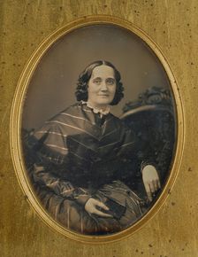 Portrait of a woman holding a book, about 1850. Creator: Southworth and Hawes