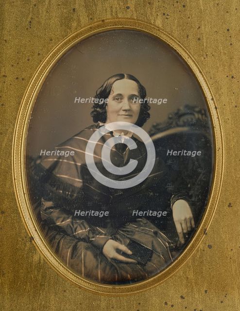 Portrait of a woman holding a book, about 1850. Creator: Southworth and Hawes.