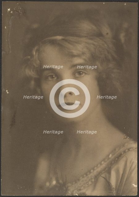 Portrait of a Woman Holding Bouquet with Fern, 1907-1924. Creator: Louis Fleckenstein.