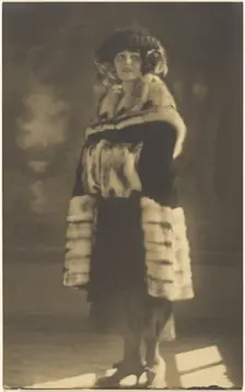 Portrait of a Woman in Fur Coat with Muff, 1907-1943. Creator: Louis Fleckenstein