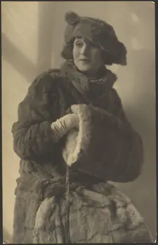 Portrait of a Woman in Furs with Muff, 1907-1943. Creator: Louis Fleckenstein