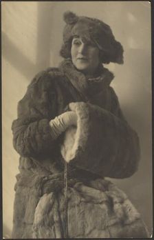 Portrait of a Woman in Furs with Muff, 1907-1943. Creator: Louis Fleckenstein