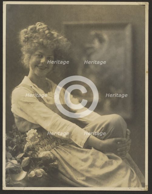 Portrait of a Woman in Pinafore with Flowers, 1907-1943. Creator: Louis Fleckenstein.