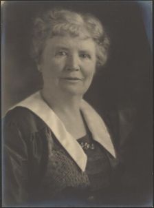 Portrait of a Woman in Striped Dress, 1907-1943. Creator: Louis Fleckenstein