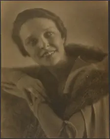 Portrait of a Woman Leaning on Chair, 1907-1943. Creator: Louis Fleckenstein