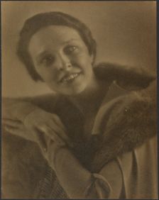 Portrait of a Woman Leaning on Chair, 1907-1943. Creator: Louis Fleckenstein