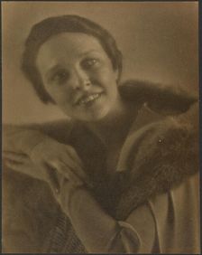 Portrait of a Woman Leaning on Chair, 1907-1943. Creator: Louis Fleckenstein