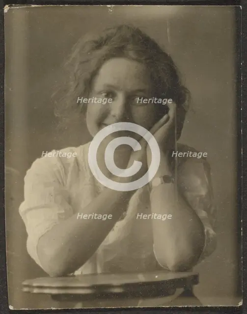 Portrait of a Woman Leaning on Table, 1907-1943. Creator: Louis Fleckenstein.
