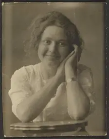 Portrait of a Woman Leaning on Table, 1907-1943. Creator: Louis Fleckenstein
