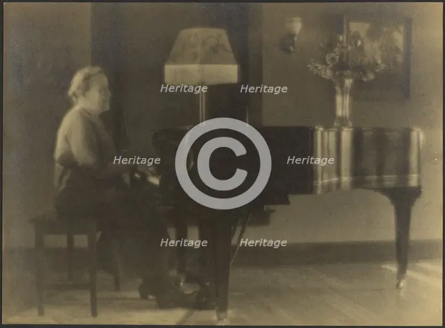 Portrait of a Woman Seated at the Piano, 1895-1907. Creator: Louis Fleckenstein.