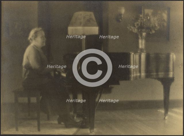 Portrait of a Woman Seated at the Piano, 1895-1907. Creator: Louis Fleckenstein.