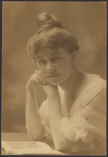 Portrait of a Woman Seated with Magazine, 1907-1943. Creator: Louis Fleckenstein