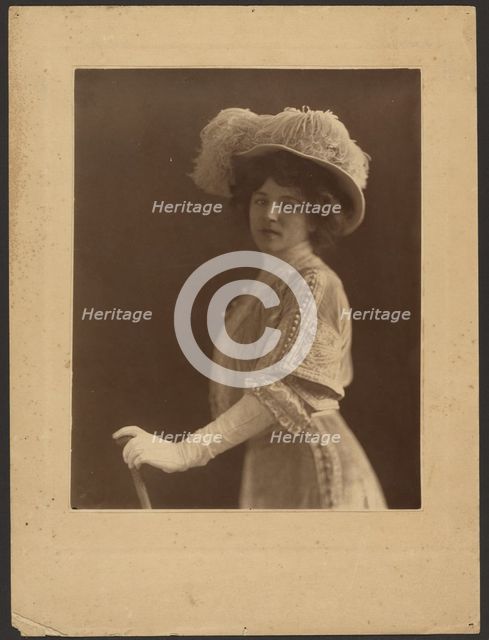 Portrait of a Woman Standing with Umbrella, 1907-1943. Creator: Louis Fleckenstein.