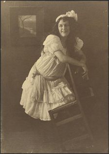 Portrait of a Young Woman with Chair, 1907-1943. Creator: Louis Fleckenstein