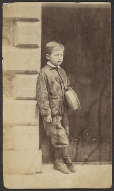 Portrait of a Young Boy in a Doorway, late 19th century. Creator: Unknown