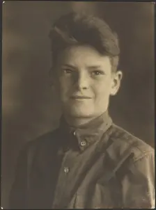 Portrait of a Young Boy in Button Up Shirt, 1907-1943. Creator: Louis Fleckenstein
