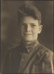 Portrait of a Young Boy in Button Up Shirt, 1907-1943. Creator: Louis Fleckenstein