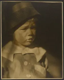 Portrait of a Young Child with Cap, 1907-1943. Creator: Louis Fleckenstein