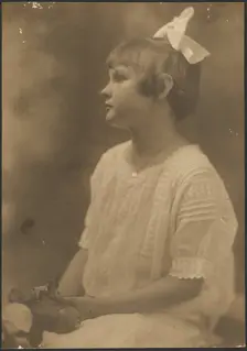 Portrait of a Young Girl with Flowers in Lap, 1907-1943. Creator: Louis Fleckenstein