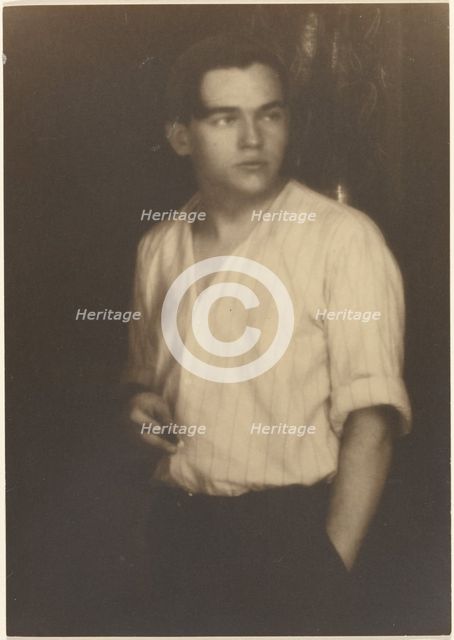 Portrait of a Young Man in Striped Shirt with Cigarette, 1907-1924. Creator: Louis Fleckenstein.