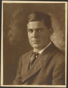 Portrait of a Young Man with Lapel Pin, 1907-1943. Creator: Louis Fleckenstein