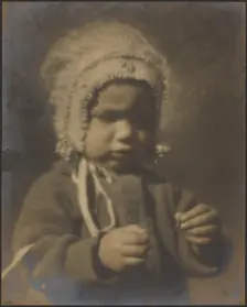 Portrait of a Child Wearing a Bonnet, 1907-1943. Creator: Louis Fleckenstein