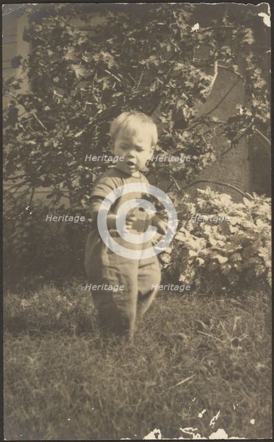 Portrait of a Child in Garden, 1907-1924. Creator: Louis Fleckenstein.