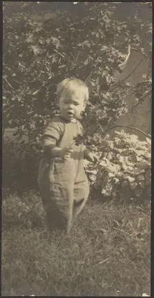Portrait of a Child in Garden, 1907-1924. Creator: Louis Fleckenstein