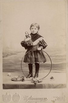 Portrait of a girl with a hoop and a doll, 1900. Creator: I. Antonopulo