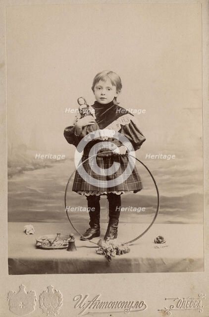 Portrait of a girl with a hoop and a doll, 1900. Creator: I. Antonopulo.