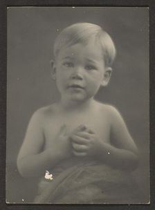 Portrait of a Little Boy in Draped Cloth, 1907-1943. Creator: Louis Fleckenstein