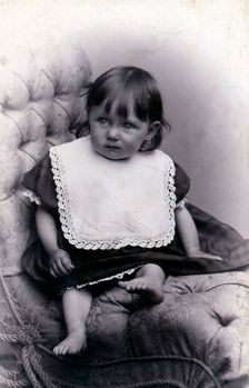 Portrait of a little girl in a big chair, c1910. Creator: Unknown