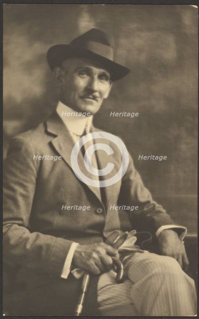Portrait of a Man Holding Cane and Gloves, 1907-1943. Creator: Louis Fleckenstein.