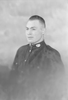 Portrait of a man in uniform, c1935. Creator: Kirk & Sons of Cowes