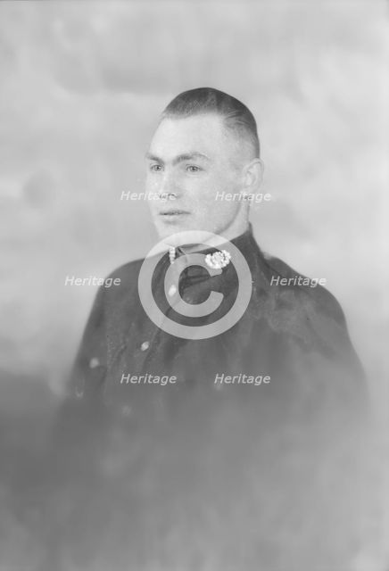 Portrait of a man in uniform, c1935. Creator: Kirk & Sons of Cowes.