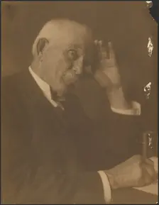 Portrait of a Man Seated at Desk, 1907-1943. Creator: Louis Fleckenstein