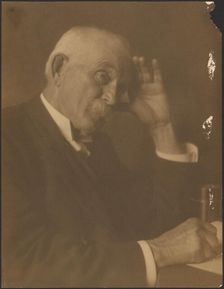 Portrait of a Man Seated at Desk, 1907-1943. Creator: Louis Fleckenstein
