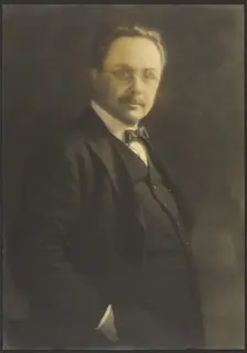 Portrait of a Man Standing with Hand in Pocket, 1907-1943. Creator: Louis Fleckenstein