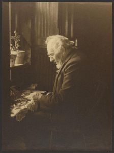 Portrait of a Man Working at Desk, 1895-1943. Creator: Louis Fleckenstein