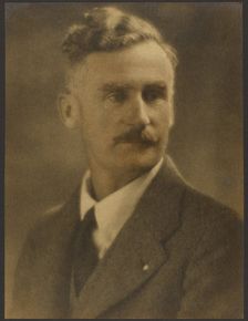 Portrait of a Man with White Lapel Pin, 1907-1943. Creator: Louis Fleckenstein