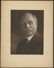 Portrait of a Man with Metal Lapel Pin, 1907-1924. Creator: Louis Fleckenstein