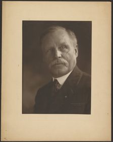 Portrait of a Man with Metal Lapel Pin, 1907-1924. Creator: Louis Fleckenstein