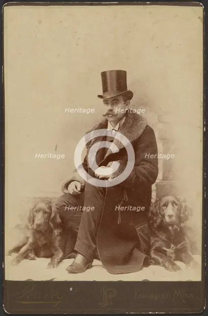 Portrait of a Moustachioed Seated Man in Top Hat and Winter, Fur-Collared Coat..., about 1890. Creator: Lewis Peavey.
