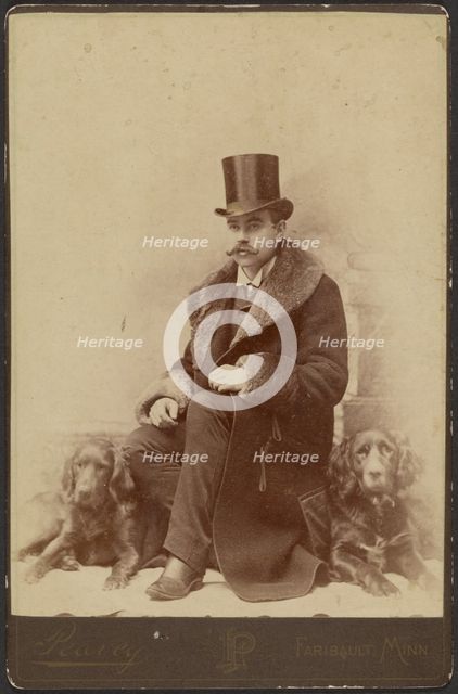 Portrait of a Moustachioed Seated Man in Top Hat and Winter, Fur-Collared Coat..., about 1890. Creator: Lewis Peavey.