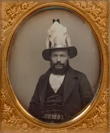 Portrait of a Seated Bearded Man Wearing a Tall, Decorative Helmet, about 1854. Creator: George D. Hamilton