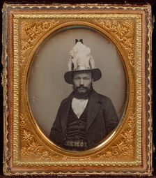 Portrait of a Seated Bearded Man Wearing a Tall, Decorative Helmet, about 1854. Creator: George D. Hamilton