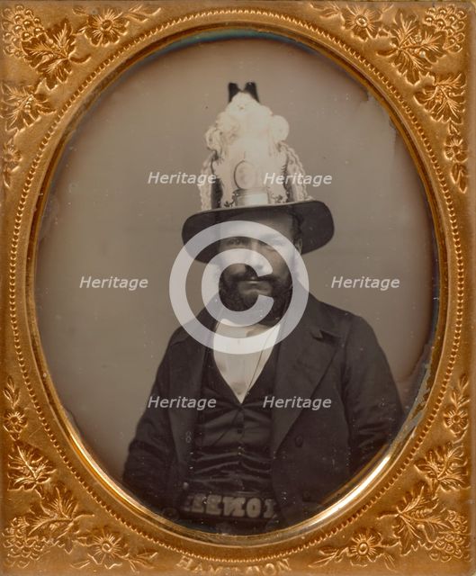 Portrait of a Seated Bearded Man Wearing a Tall, Decorative Helmet, about 1854. Creator: George D. Hamilton.