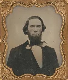 Portrait of a Seated Man with Chin Beard and Long Hair in Bow Tie, about 1860. Creator: Unknown