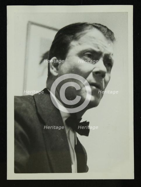 Portrait of American guitarist an banjo player Eddie Condon, 1950s. Creator: Denis Williams.